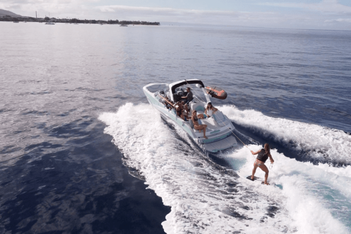 a man riding a wave on top of a body of water